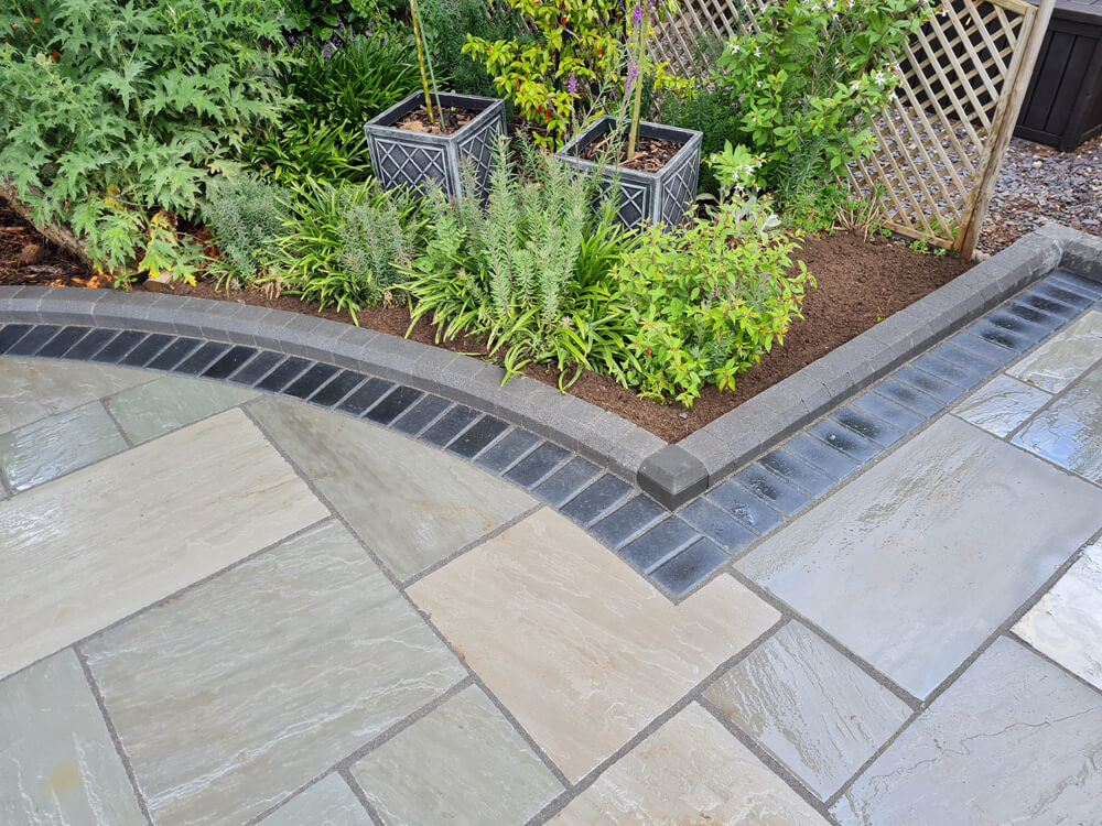 Case Study Grey Sandstone Slabs with Charcoal Block Paving Border